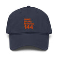 Shakespeare Revisited garment-washed cap with coral logo in navy, front view
